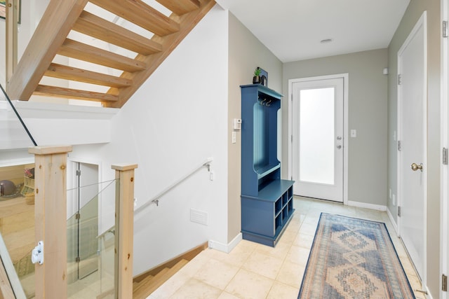 foyer featuring light tile patterned floors