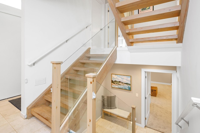 staircase with carpet floors