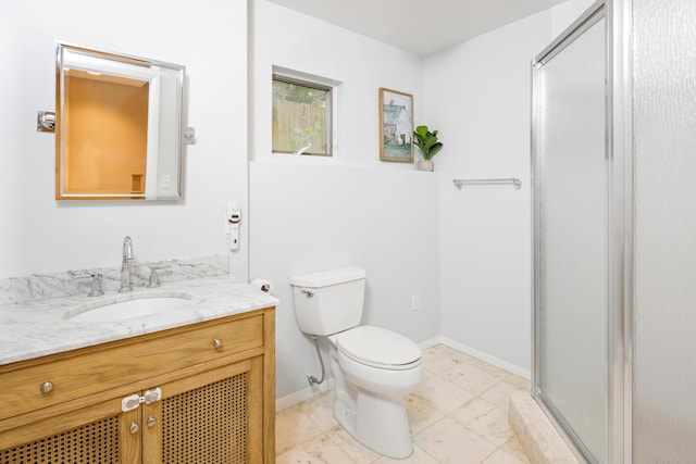 bathroom featuring walk in shower, vanity, and toilet