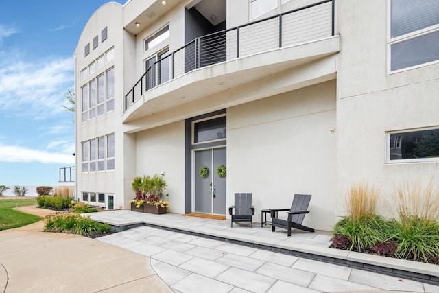 exterior space featuring a patio area and a balcony