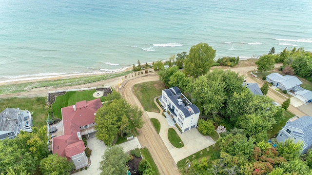 drone / aerial view with a beach view and a water view