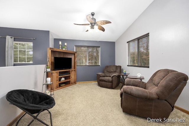 living room featuring carpet flooring, ceiling fan, a healthy amount of sunlight, and lofted ceiling