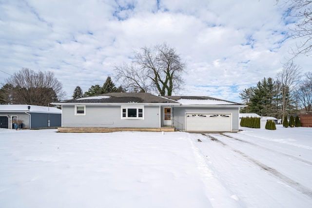 ranch-style house featuring a garage