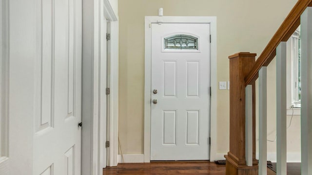 entrance foyer with dark hardwood / wood-style floors