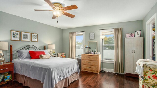 bedroom featuring ceiling fan and dark hardwood / wood-style flooring