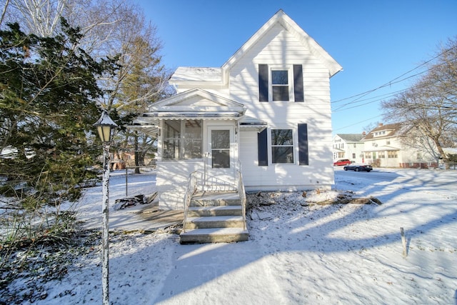 view of front of house featuring a sunroom