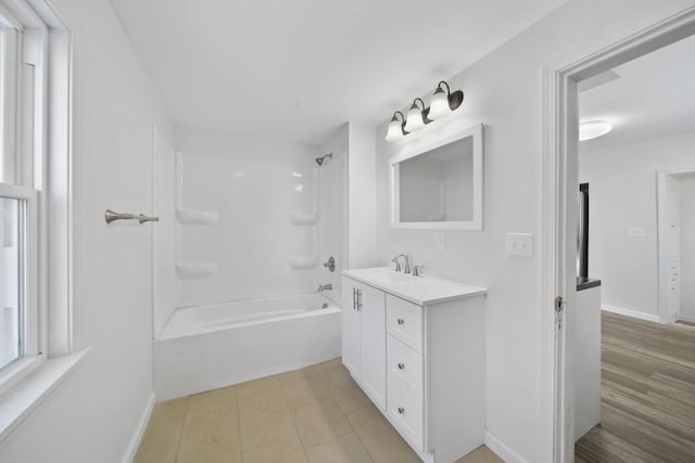 bathroom featuring shower / tub combination and vanity