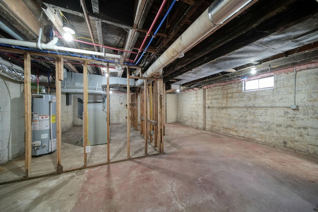 basement with gas water heater and heating unit