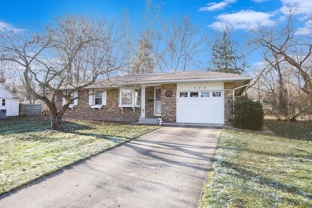 single story home with a front yard and a garage