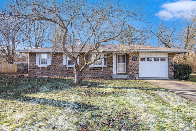 ranch-style home with a front lawn and a garage