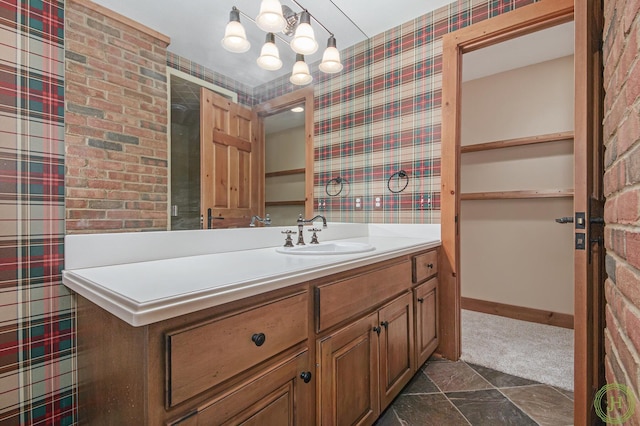 bathroom featuring vanity and a chandelier