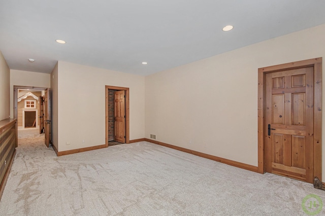 empty room with light colored carpet