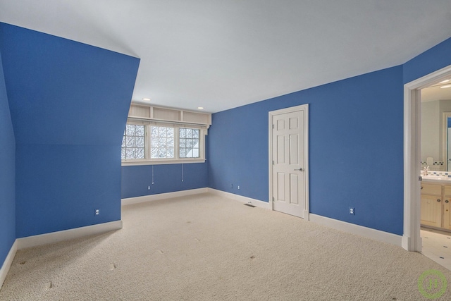 interior space featuring light colored carpet