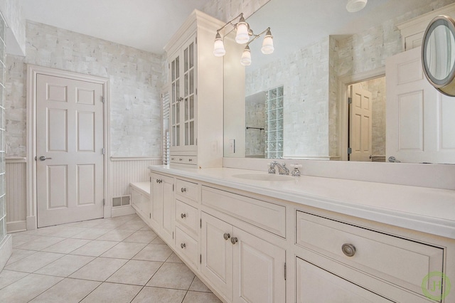 bathroom with tile patterned flooring and vanity