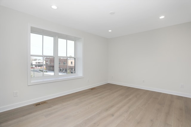 unfurnished room featuring light hardwood / wood-style flooring