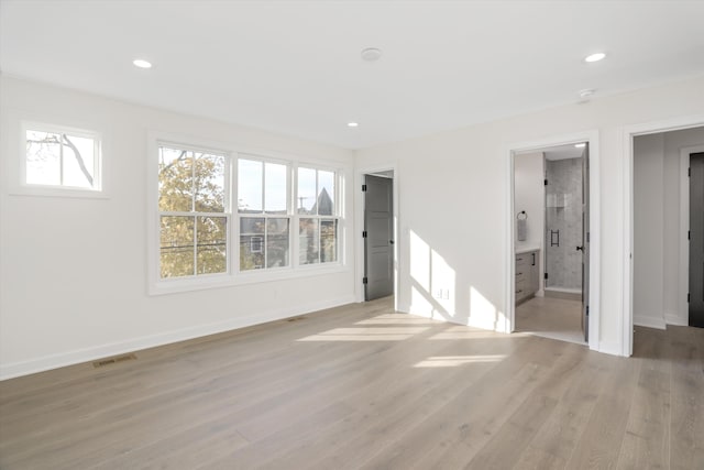 spare room featuring light hardwood / wood-style floors