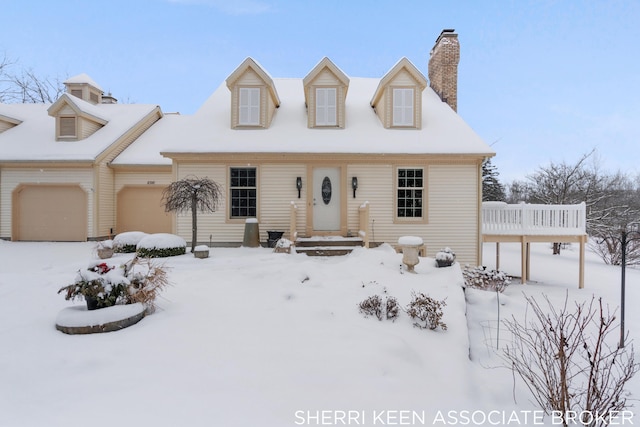 new england style home with a garage