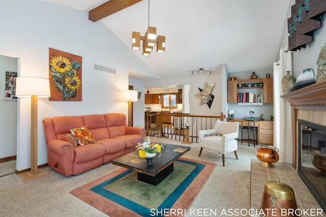 carpeted living room featuring beamed ceiling, high vaulted ceiling, and an inviting chandelier