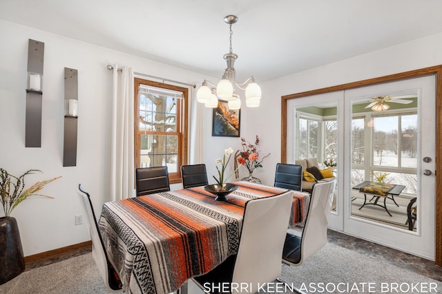 dining area featuring carpet floors and a notable chandelier