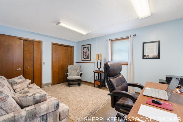 office area with light hardwood / wood-style flooring