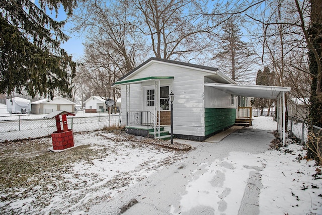 exterior space featuring a carport