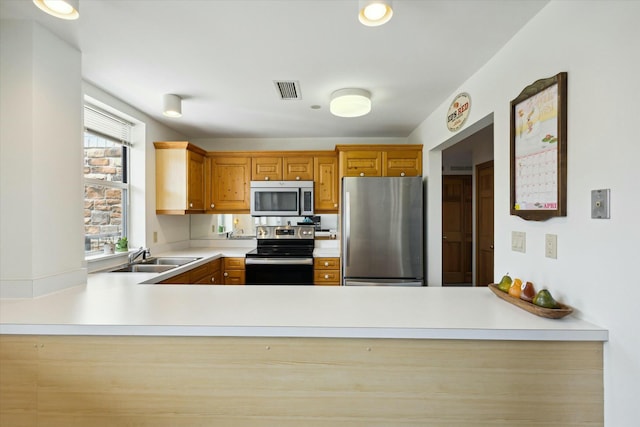 kitchen with sink and appliances with stainless steel finishes