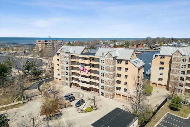 birds eye view of property with a water view