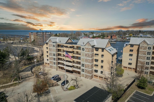 outdoor building at dusk featuring a water view