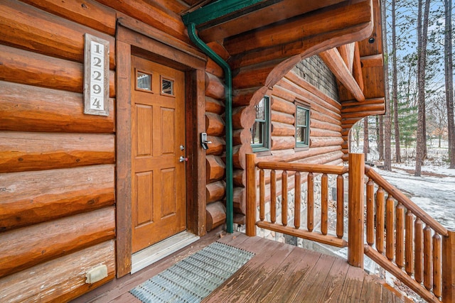 view of snow covered property entrance