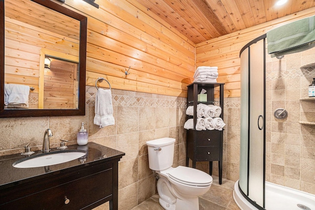 bathroom featuring toilet, tile walls, a shower with door, wooden ceiling, and vanity