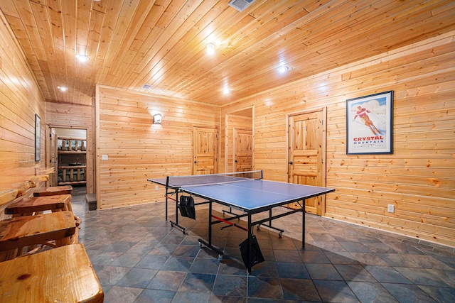 game room with wood walls and wood ceiling