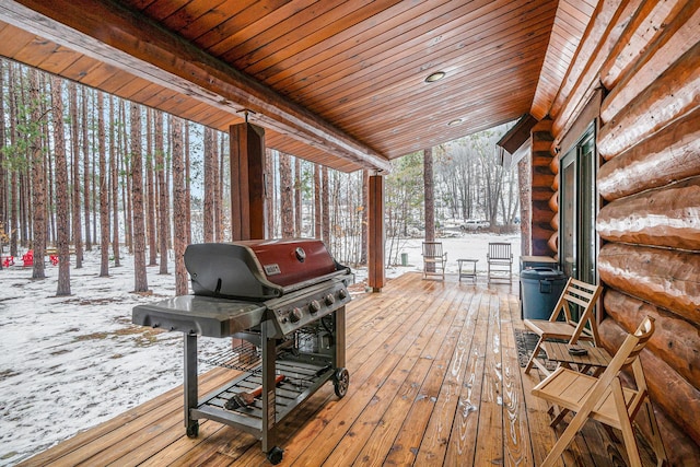 snow covered deck with grilling area