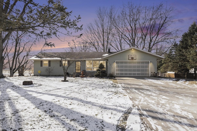 single story home featuring a garage