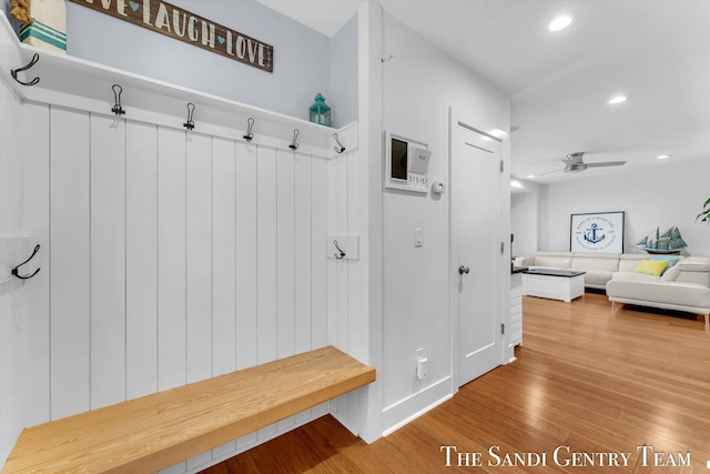 mudroom with ceiling fan and hardwood / wood-style floors