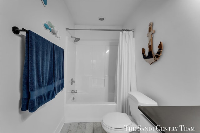 bathroom featuring shower / bath combination with curtain, toilet, and hardwood / wood-style floors