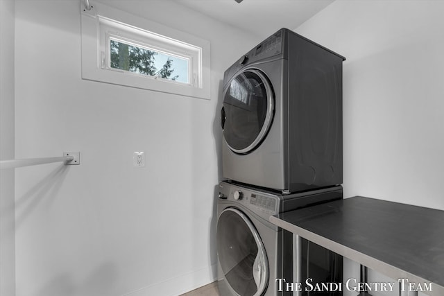 washroom featuring stacked washer and dryer