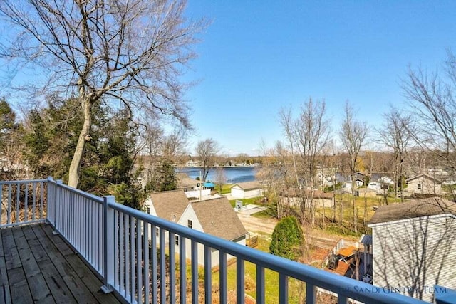 wooden deck featuring a water view