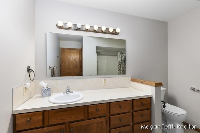 bathroom with vanity and toilet