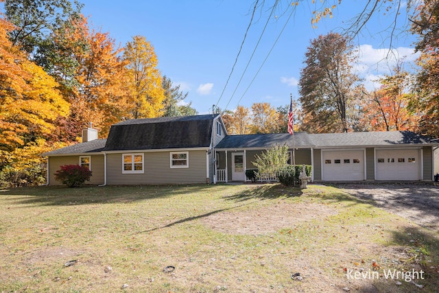 ranch-style home with a garage and a front lawn