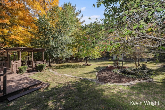 view of yard with a pergola and a wooden deck