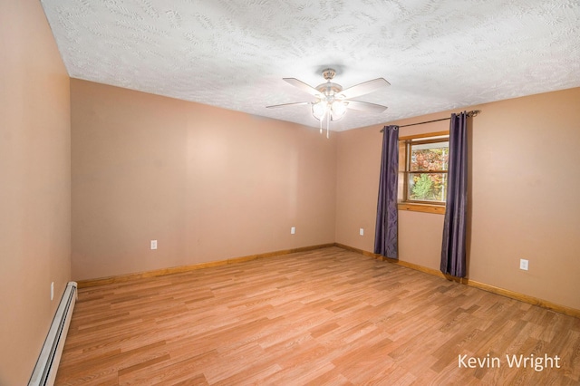 spare room with ceiling fan, light hardwood / wood-style floors, a textured ceiling, and a baseboard radiator