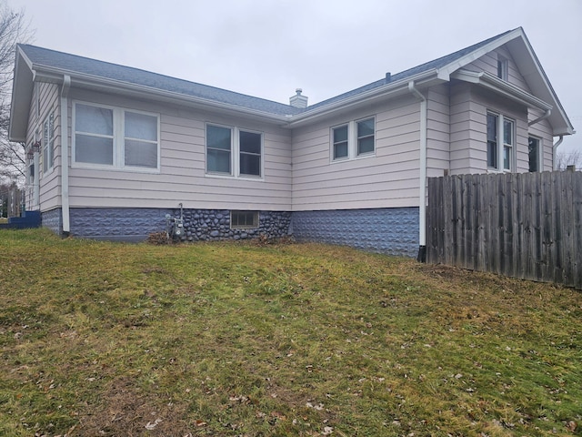 view of home's exterior with a yard