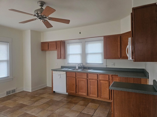 kitchen with plenty of natural light, ceiling fan, sink, and white appliances