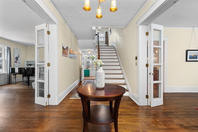 entryway featuring dark wood-type flooring and french doors