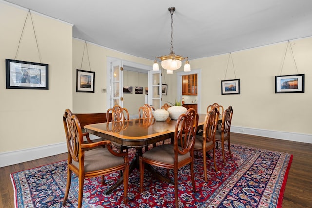 dining room with dark wood-type flooring