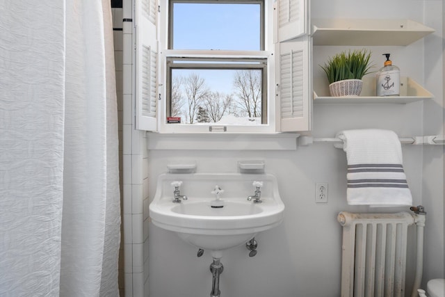 bathroom featuring radiator