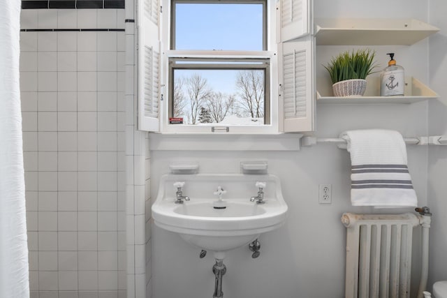 bathroom featuring radiator heating unit