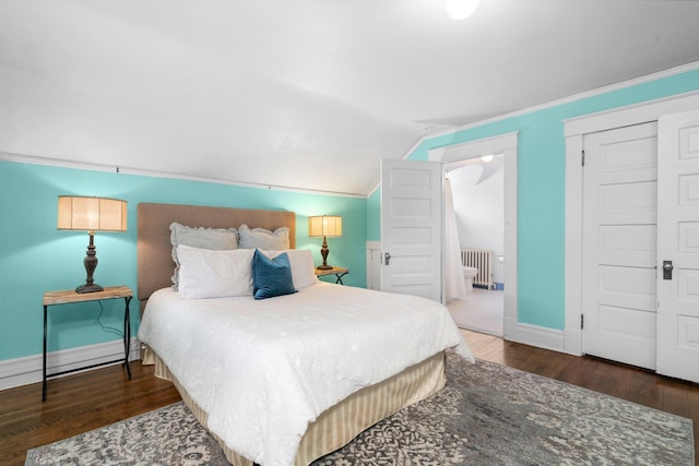 bedroom with crown molding, vaulted ceiling, dark hardwood / wood-style flooring, and a closet