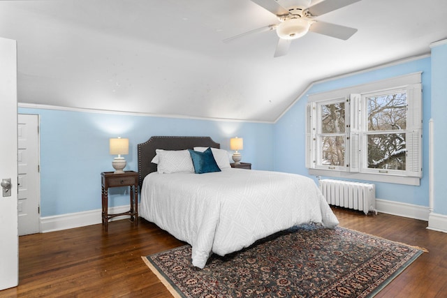 bedroom featuring dark wood-type flooring, ceiling fan, radiator heating unit, and lofted ceiling