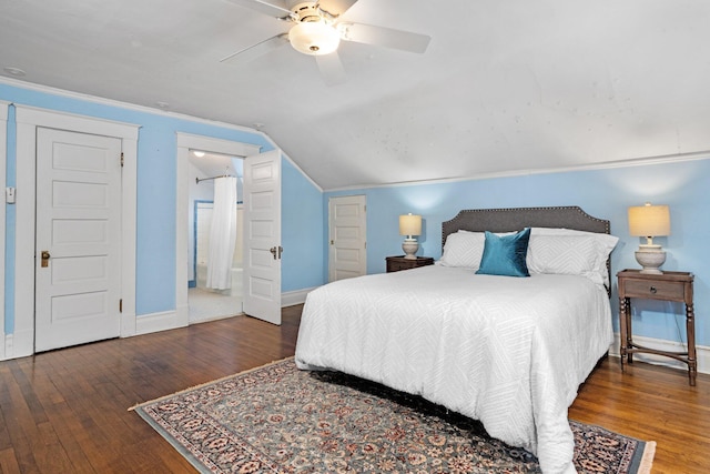 bedroom featuring dark wood-type flooring, ceiling fan, crown molding, and vaulted ceiling